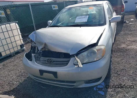 2003 Toyota Corolla Le z USA, uszkodzony, nr VIN JTDBR32E232014838